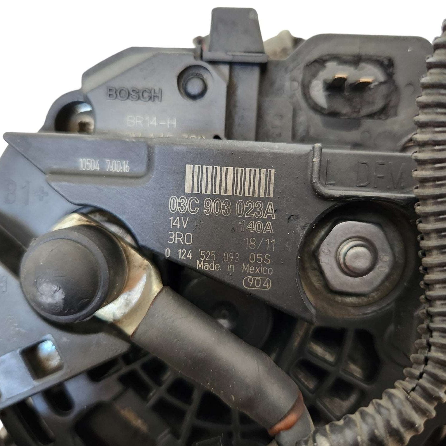 Used 03C903023A Original VAG alternator showing signs of wear, compatible with VW Audi Seat 1.4 TSI vehicles